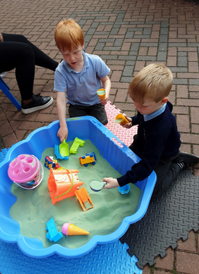 Boys playing with sand